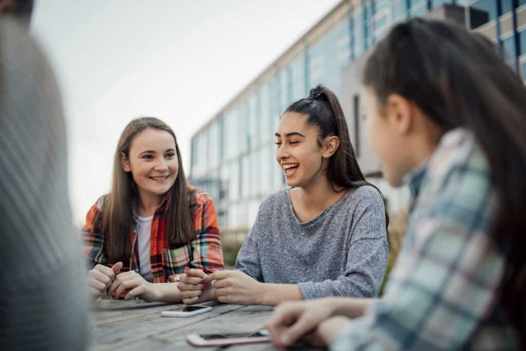 Diverse group of students studying outdoors at Carnegie Higher Ed.